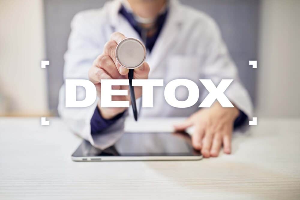 medical doctor in front of the word detox