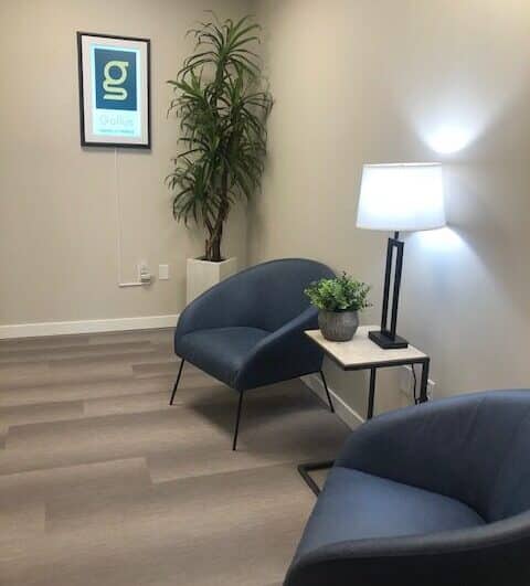 Office interior at the Gallus Detox Center in Denver with comfortable chairs in a clean, minimal waiting room