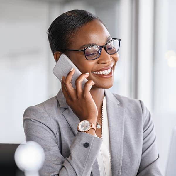 female therapist talking on cellphone in office.