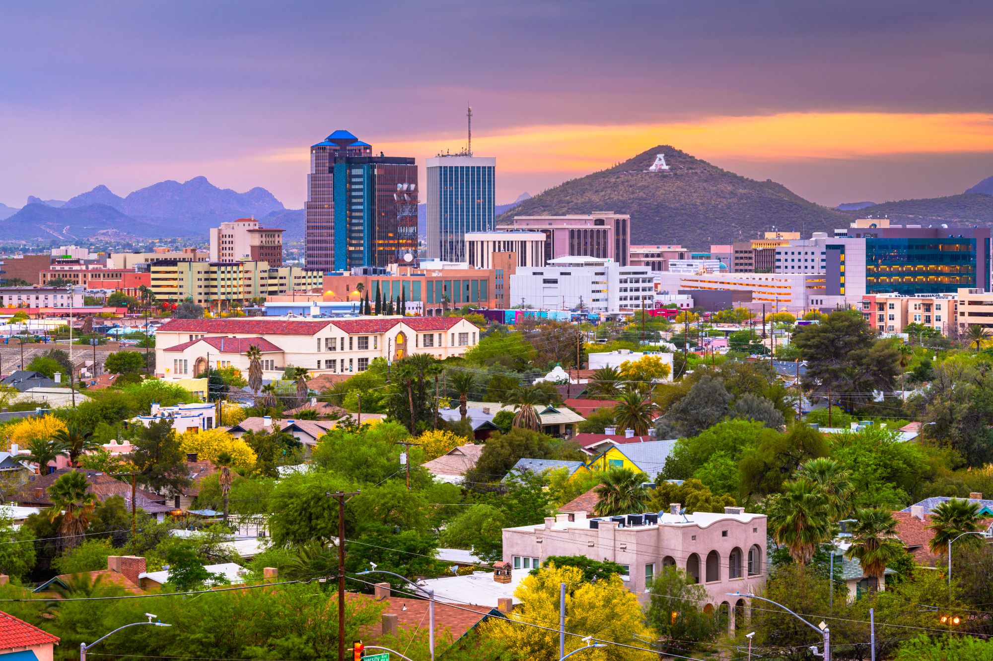 Tucson, Arizona, USA downtown city skyline with mountains at twilight.