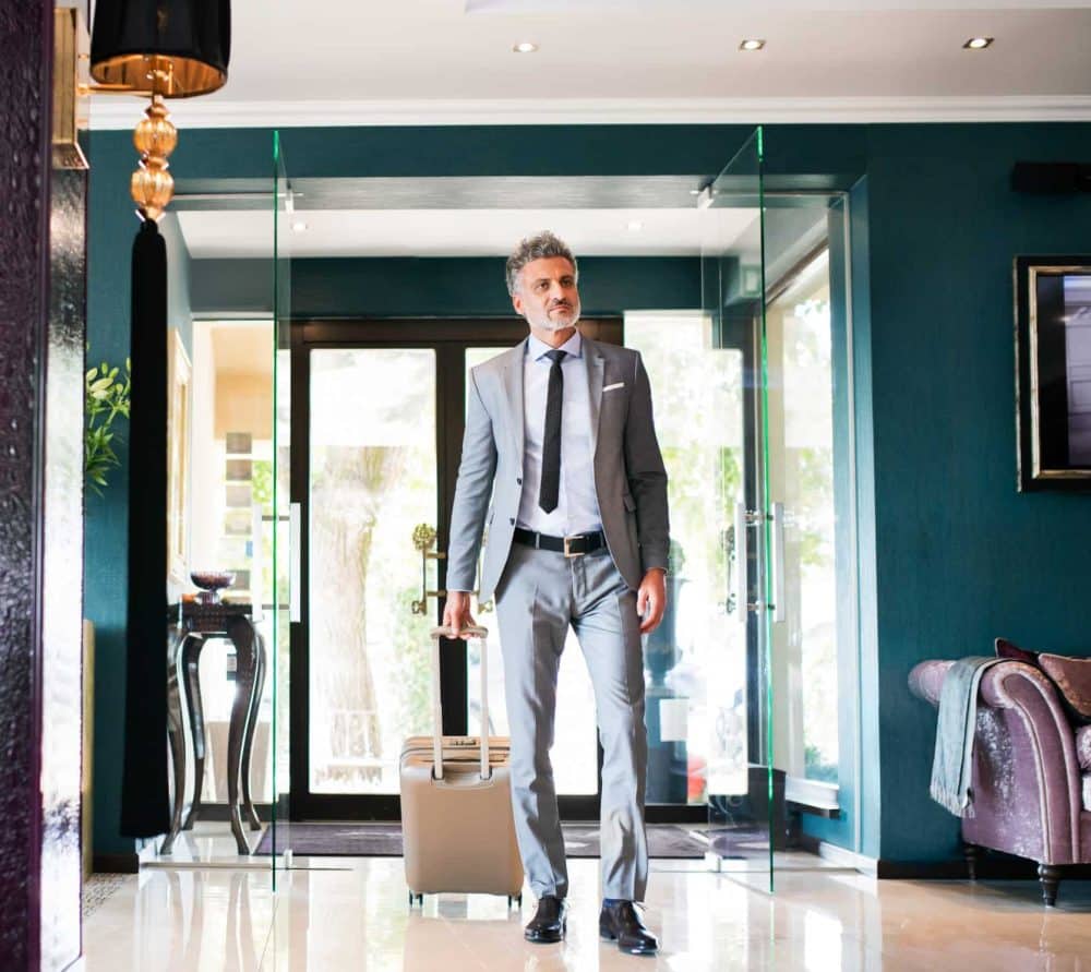 professional business executive arriving for luxury stay