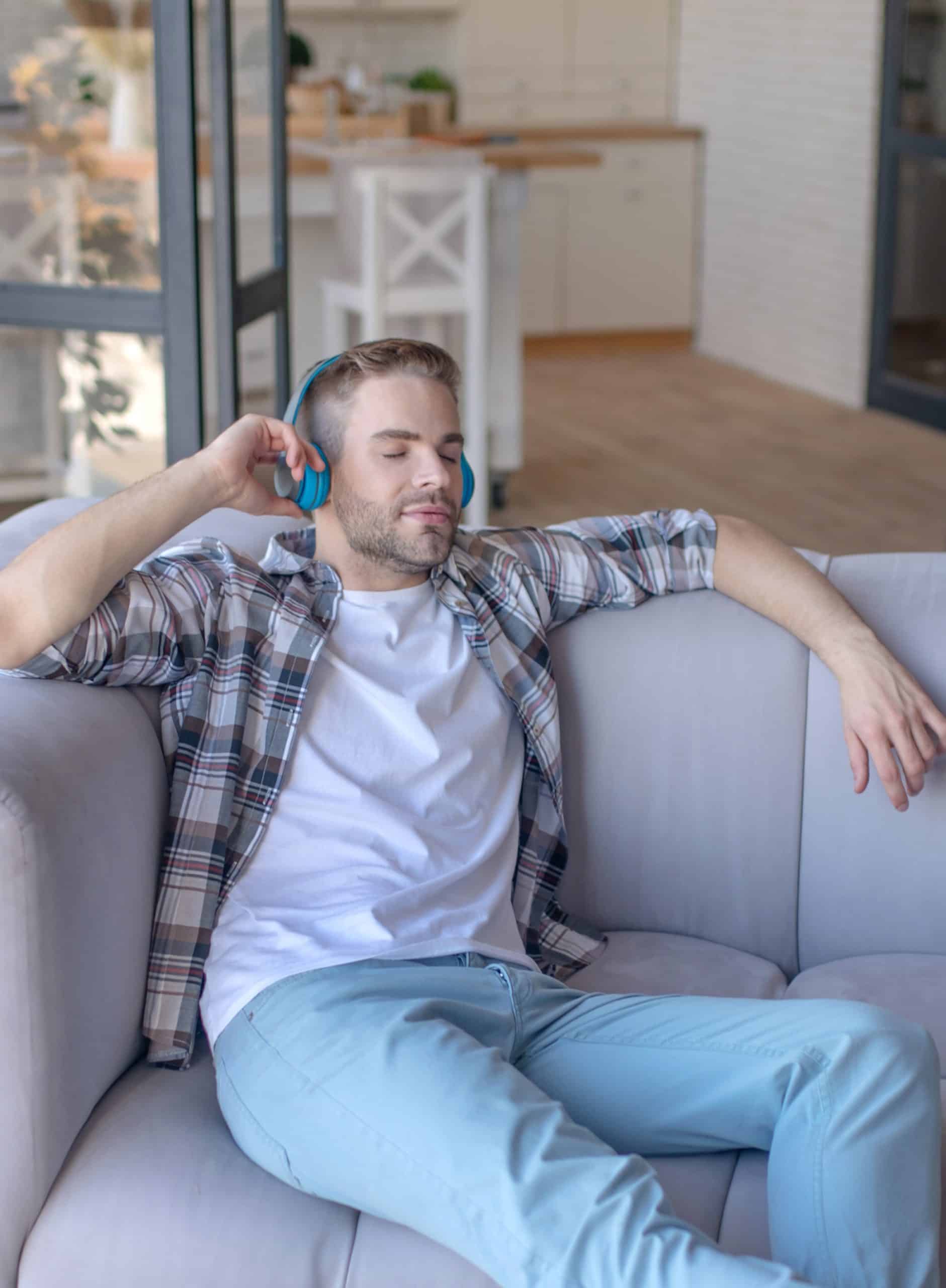 man-comfortable-on-couch-relaxed
